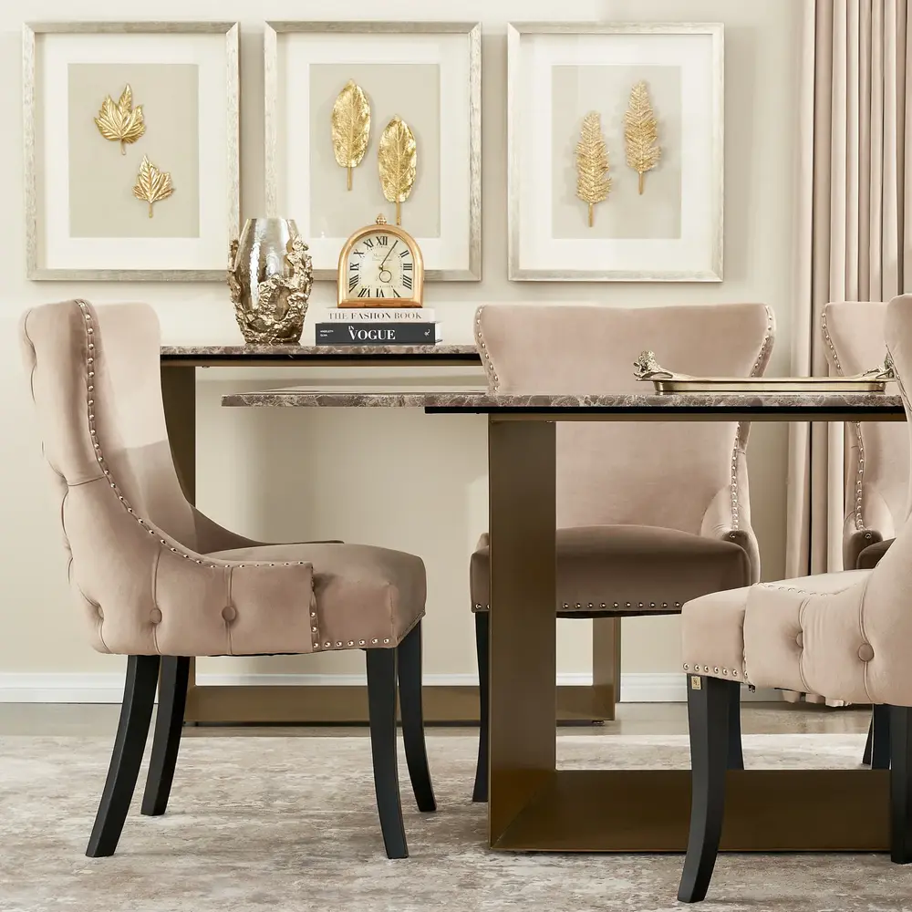 Rectangular dining table with a brown marble tabletop supported by a brushed bronze-colored stainless steel frame, seating up to 8 people.
