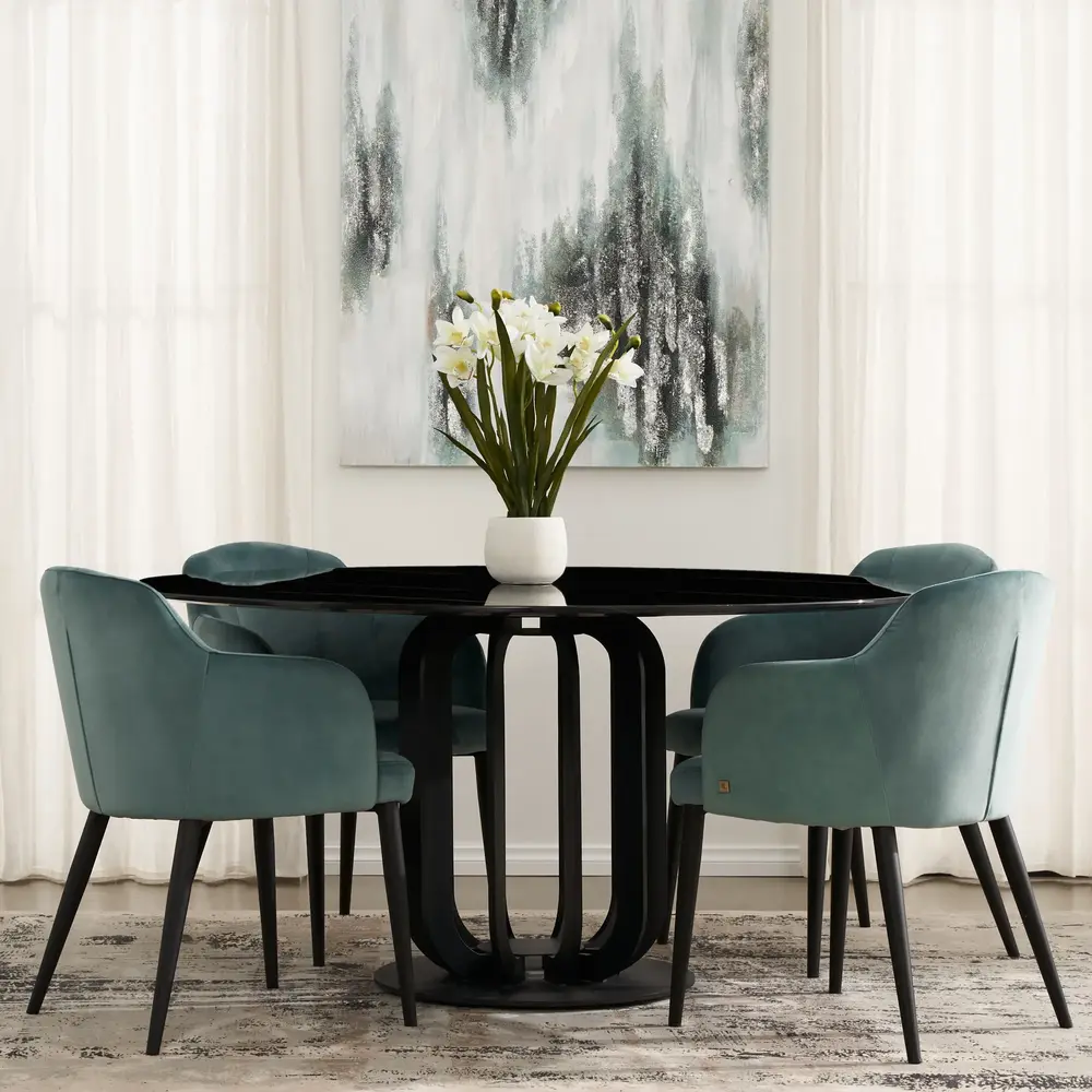 Round Dining Table with a black marble table top supported by a geometric designed pedestal in black with open sections. Seats up to 6 people.