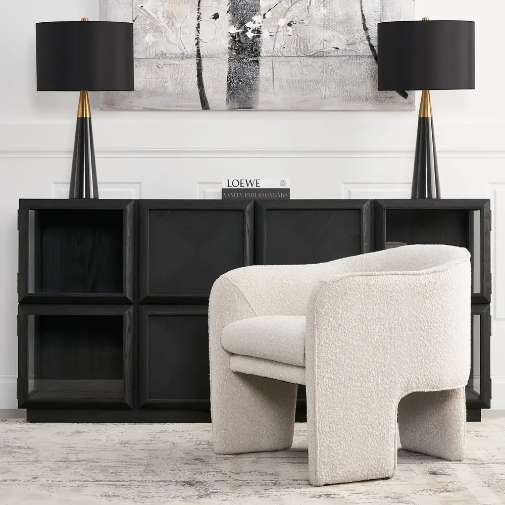 Cream boucle armchair featuring a three-section design with matching cream boucle legs, comfortable cushioned seats, and a supportive backrest.